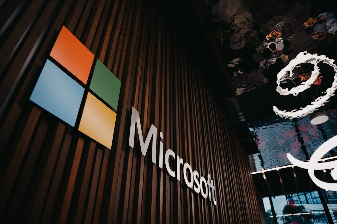 Microsoft logo on a building wall, representing the company associated with Windows XP and its end of support announcement