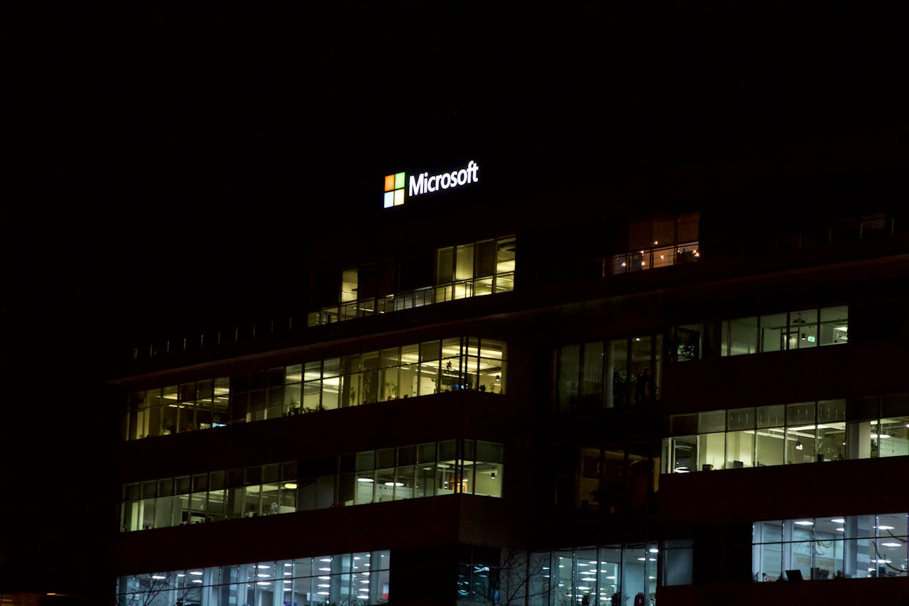 Microsoft office building at night, representing the company behind Windows XP and its end of support milestone