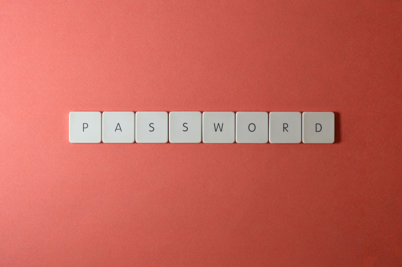 Password tiles arranged on a red background representing strong password habits that support Dropbox account security
