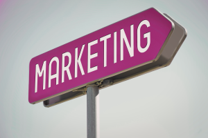 Marketing sign representing strategic direction and growth decisions for small businesses choosing between inbound and outbound marketing