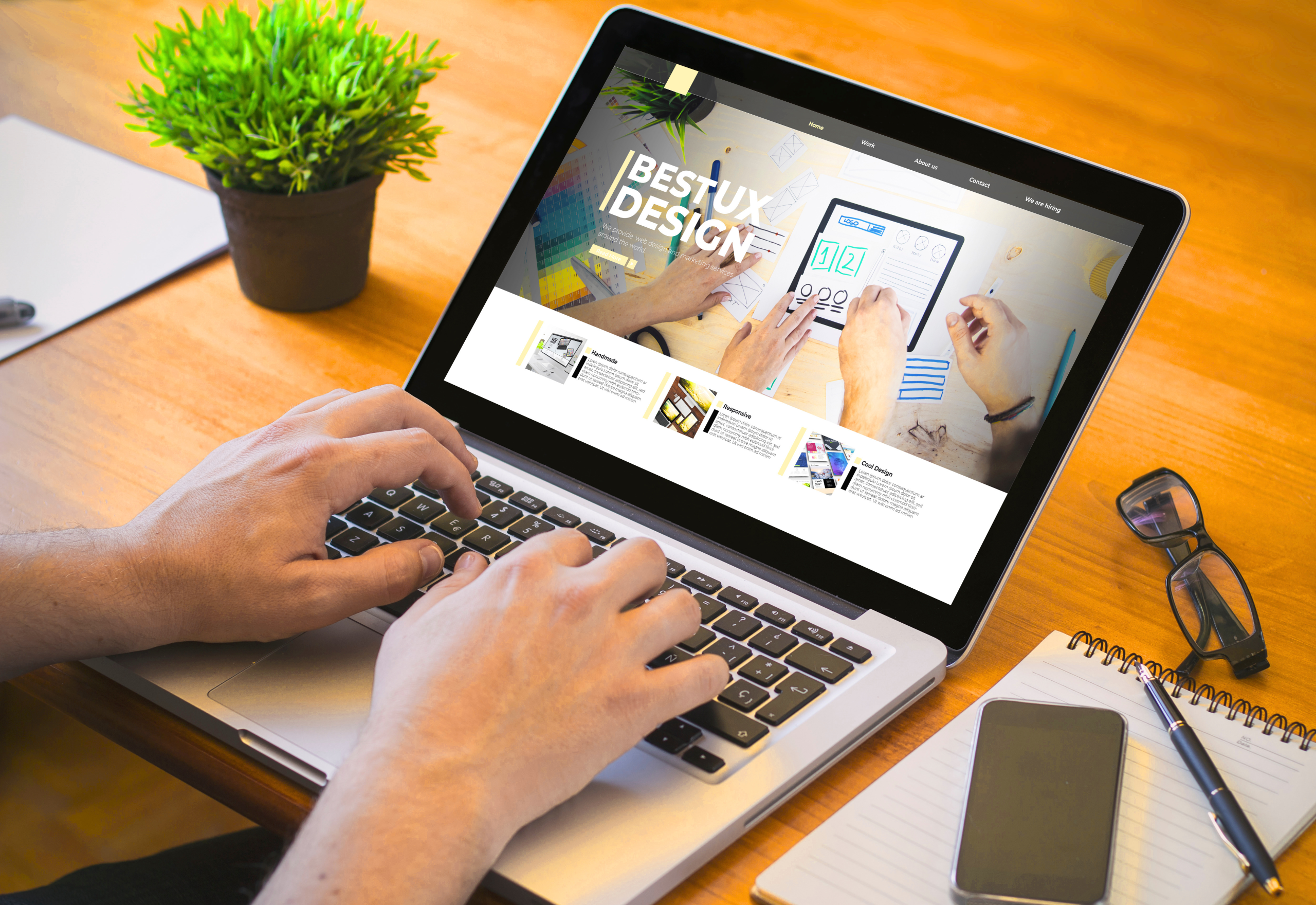 Person reviewing a website design on a laptop, representing website design issues that can impact conversions and cost a business leads