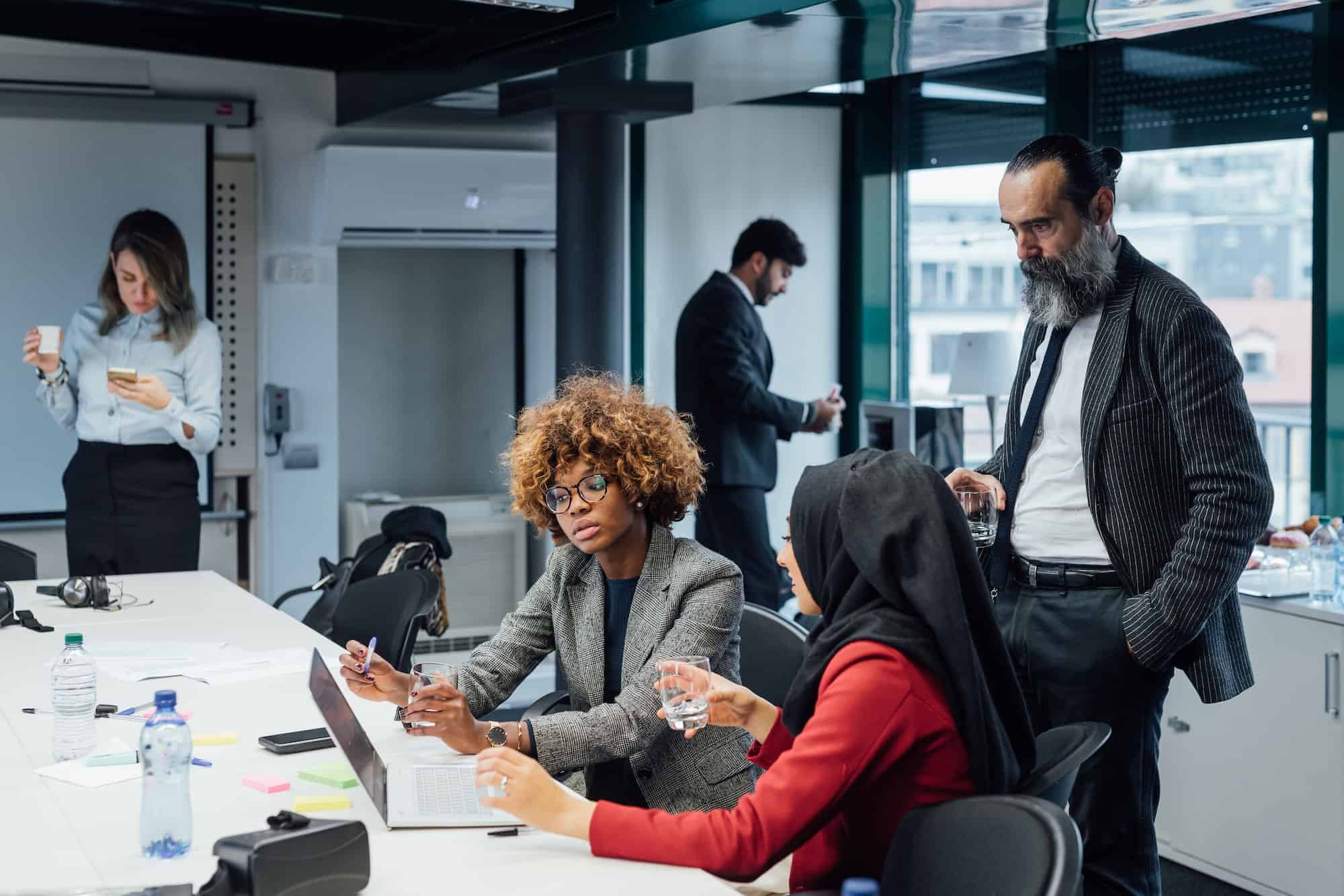 Business professionals in a meeting room representing Clearline Business Solutions mission, vision, and approach.